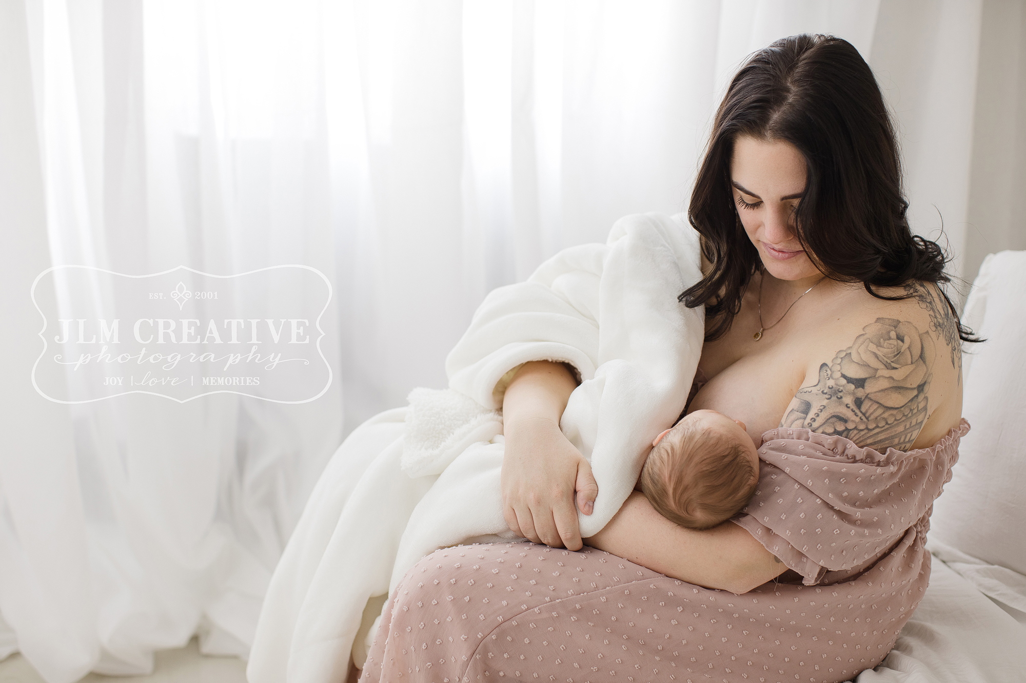 mom nurses baby girl
